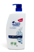 Head & Shoulders Classic schampo i vit flaska med blå pump, dekorerad med bubbelmotiv och röd volymmarkering på 1000 ml.